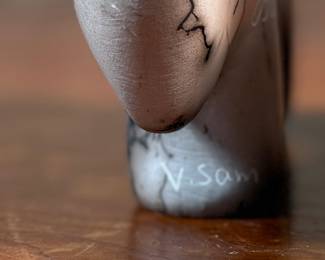 This lot features a pair of beautiful Native American Navajo horse hair pottery buffalo sculptures. Both are signed by artists as shown in photos and each measures, 4” H x 6.5” W x 1.25” D.
