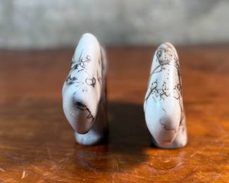 This lot features a pair of beautiful Native American Navajo horse hair pottery buffalo sculptures. Both are signed by artists as shown in photos and each measures, 4” H x 6.5” W x 1.25” D.
