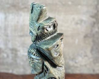 This lot features a stunning Inuit spirit carving in green soapstone by listed Inuit artist, Tytosie Tunnillie. Signed underneath as shown in photos and measures, 13” H x 8.5” W x 4.5” D.
