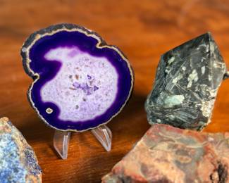 This lot features a collection of stunning rocks & minerals. The raw emerald tower weighs 15.5oz and measures, 3.5” H. The raw azurite rough freeform is from Phoenix and weighs 6.7oz and measures, 3.5” H x 2.5” W. The petrified wood heart weighs 7.6oz and measures, 3” W.
