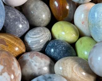 This lot features a collection of fifteen (15) polished stone eggs made from various materials in excellent condition and a fun basket to carry them to your car in!
