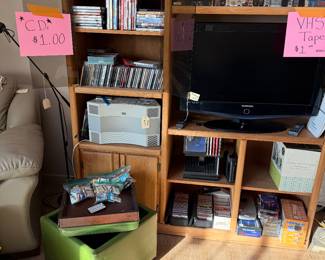 Bose Wave Stereo, DVD's, CD's and VHS.   Oak Enterainment Center, Vintage Green Ottoman. 