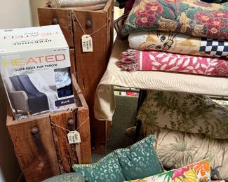 Wood crafted pedestals.  Blankets and Pillows.