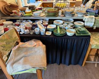 Lots of Ramikins, Dishes, Table Utensils and linens.  Tropical Print Oak Barstools. 