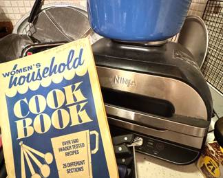 Blue Dutch Oven on Ninja Grill with Women’s Household Cookbook