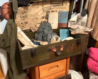 1950s military navy trunk with military items and instruction books