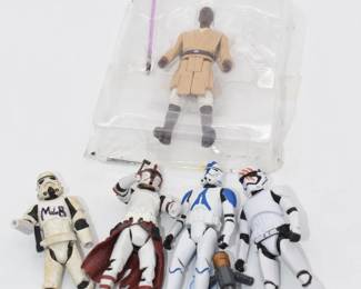 A Collection of Seven Star Wars Clone Wars Action Figures and One Accessory
