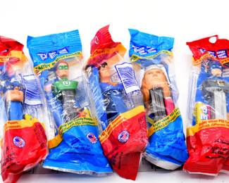 A Set of Five PEZ Superhero Candy & Dispensers
