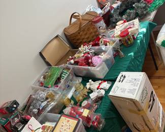 Holiday cards and ornaments. Small artificial tree.