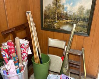 Pool sticks, wrapping paper and painting