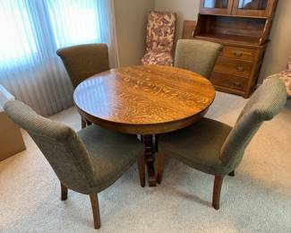 Round oak dining table (includes leaf not shown) and (4) dining chairs (sold separately)