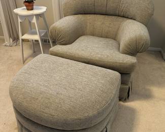 Upholstered armchair and ottoman