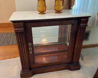 Lighted curio with marble top