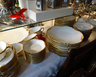 a Beautiful Set for 12 (but only 9 plates) of Limoges gold rimmed and embossed Design bearing the Pouyatt Mark