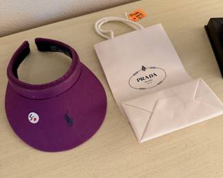 Ralph Lauren visor and Prada gift bag