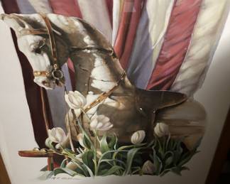 A decorative painting of a rocking horse with the American flag and tulips by N. A. Noel.