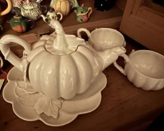 A whimsical white ceramic pumpkin-shaped teapot with matching cups and saucer. & More Unique Items  