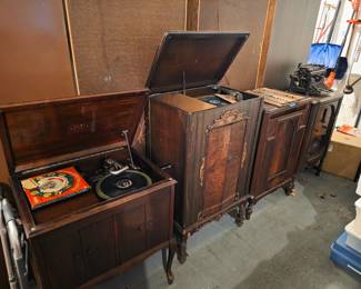 Antique record players and radio cabinets.