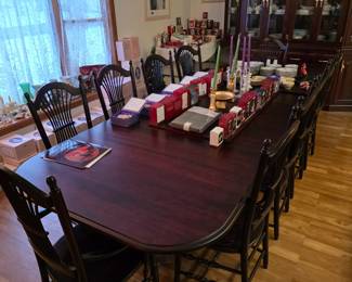 Beautiful walnut dining room table with 12 chairs! 6 foot with an additional 4 one foot extension leaves to make 10 feet.