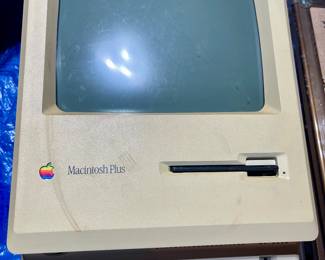 Vintage Macintosh with keyboard, mouse, cables, and case. Powers on but no display.