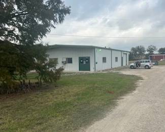 2301 Windy Hill. Warehouse with BIG Cypress trees in front. Please come! We always like to visit.