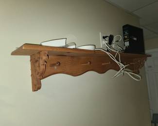 Shelf with coat hooks