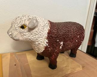 Vintage Chalkware Bull Piggy Bank
No chips or cracks, however there is the obvious paint missing.
15” long x 8” tall 