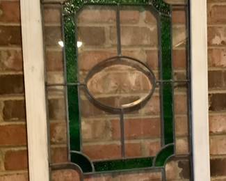 A beautiful stain glass in frame.