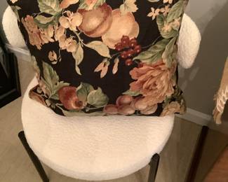 One of the 8 dining chairs with glass shelves beautiful pillow.