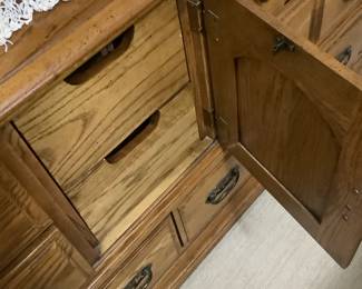 The drawers in the oak dresser.