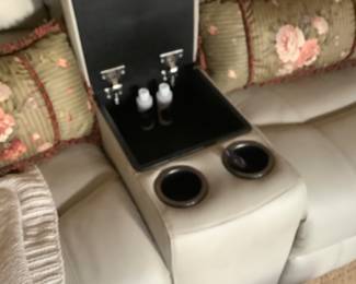 The center of the leather reclining sofa. The price for love seat and couch are: $1,906.00. New.