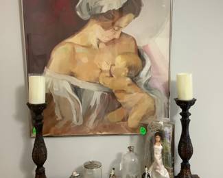 Close-up of a gorgeous picture of mother nursing her sweet baby. It is signed.