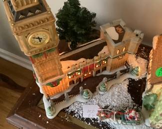 Just some of the Department 56 lighted houses on sofa table.