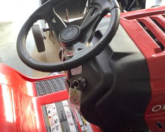 Troy-Bilt riding lawn mower with grass catcher, thatcher. Like new. Great condition. Price is: $900.00 with the attachments.