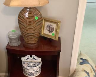 Small mahogany end tables by leather with bottom drawer and shelf in middle. The price for the end table is: $85.00