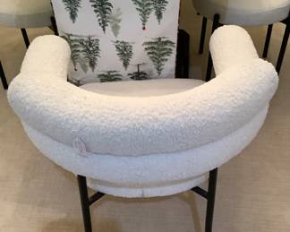 This is one of the captain chairs that has double row of back. It is 2 of them and 6 of the other ones. Total of 8. The table and chairs (which include 6 chairs) are: $1,099.00. The 2 captain chairs are $220.00 for 2.