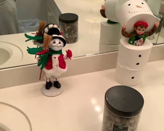 Another Anna snowman on the bath counter, but look at the little elf hiding in the toilet paper. What a surprise.
