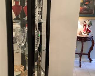 The side of the curio cabinets with glass. Price: $95.00