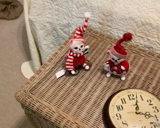 Our two little mouse on a wicker trunk. Lots of storage. Has hinges on each side of lid. Howard Miller wall clock on trunk.