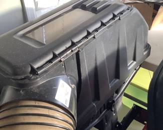 The grass catcher on lawn mower.