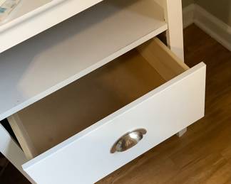 One of the end tables with drawer open.