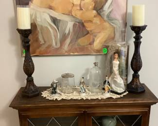 The cabinet with 2 glass doors and wood shelves.