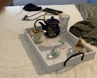 Bed tray with items, lots of vintage evening bags.