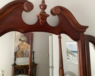 Top of mirror in dresser that matches 4 poster bed. Price of dresser is: $325.00