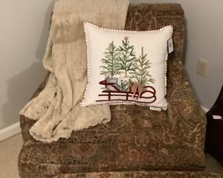 A club chair with ottoman. Has beautiful browns, blue and burgundy in it. Excellent condition.