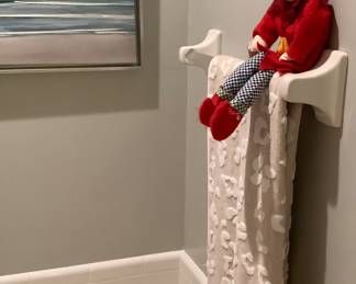 Look at the Elf hiding on the towel rack in bathroom.