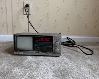 vintage GPX TV-2 portable black and white 5”television with an AM/FM radio and digital alarm clock