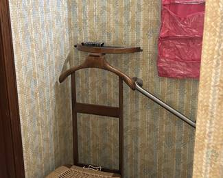 Gentleman's valet.  Seat lifts and is filled with shoe shine items.