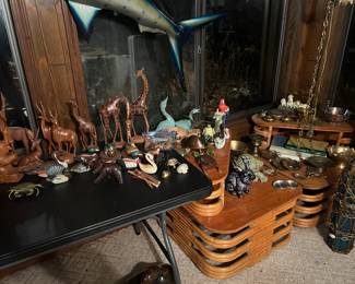 Stacked rattan end tables.  A variety of wood, glass, brass, metal animals.