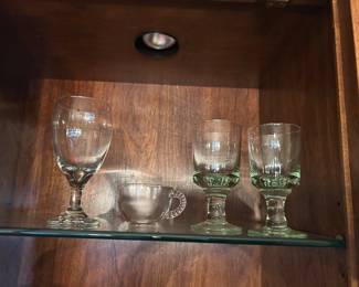 Pieces from three sets:  1) 15 large wine glass set    2) 12 punch cups    3) 34 piece green glass set with water and wine glasses.